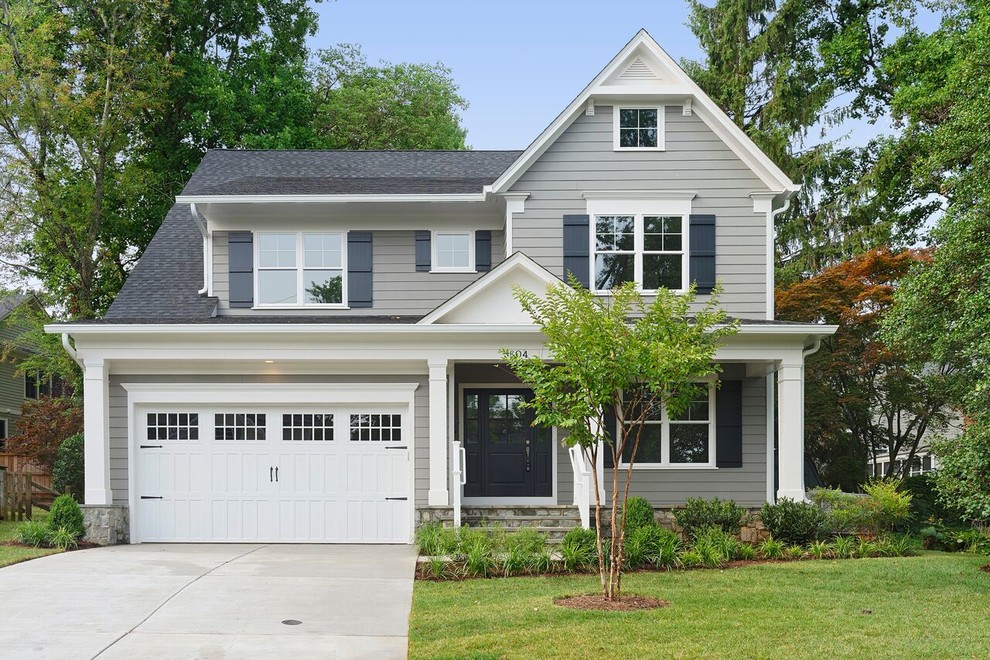 Inspiration for a mid-sized transitional two-storey grey exterior in DC Metro with vinyl siding and a gable roof.