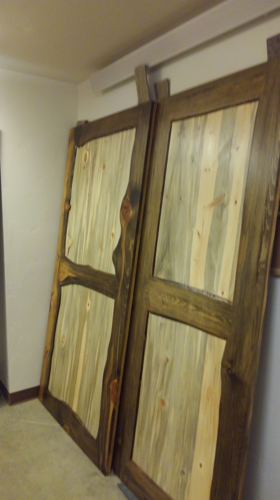 Hallway - small rustic brown floor hallway idea with white walls