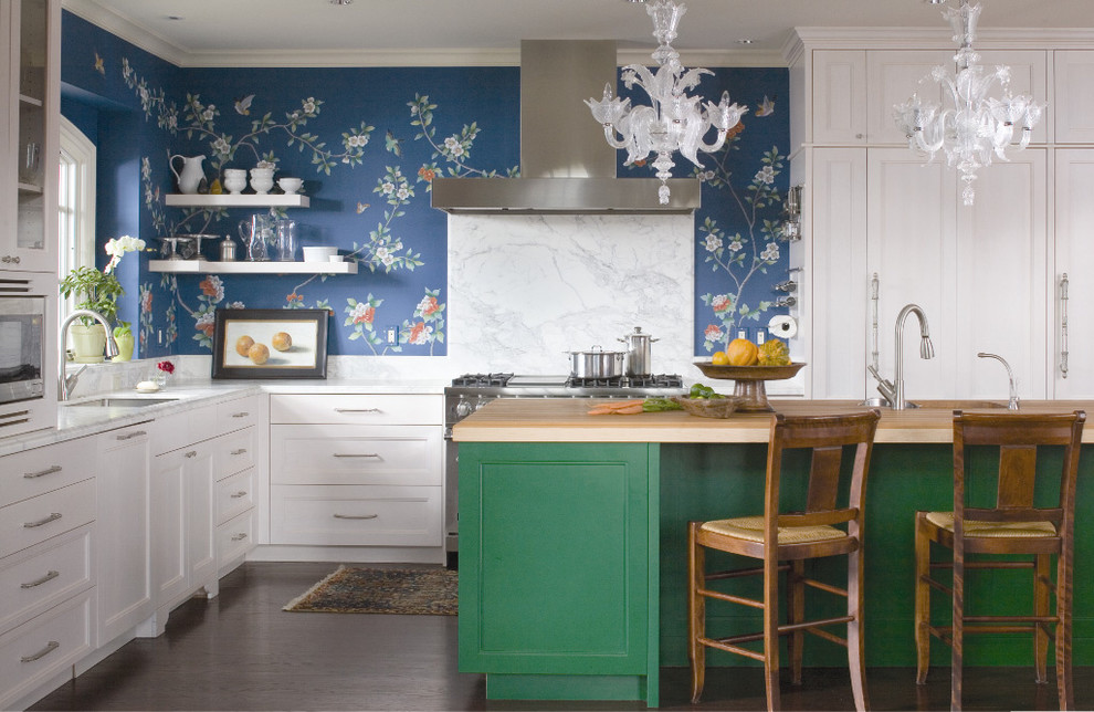 This is an example of a traditional l-shaped kitchen in Denver with panelled appliances, white cabinets, recessed-panel cabinets, marble benchtops, white splashback and stone slab splashback.