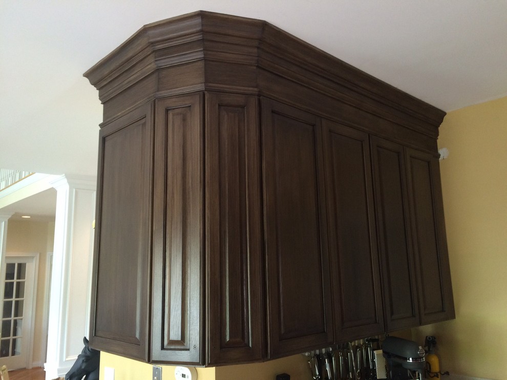 Arts and crafts kitchen in Cincinnati with raised-panel cabinets and dark wood cabinets.