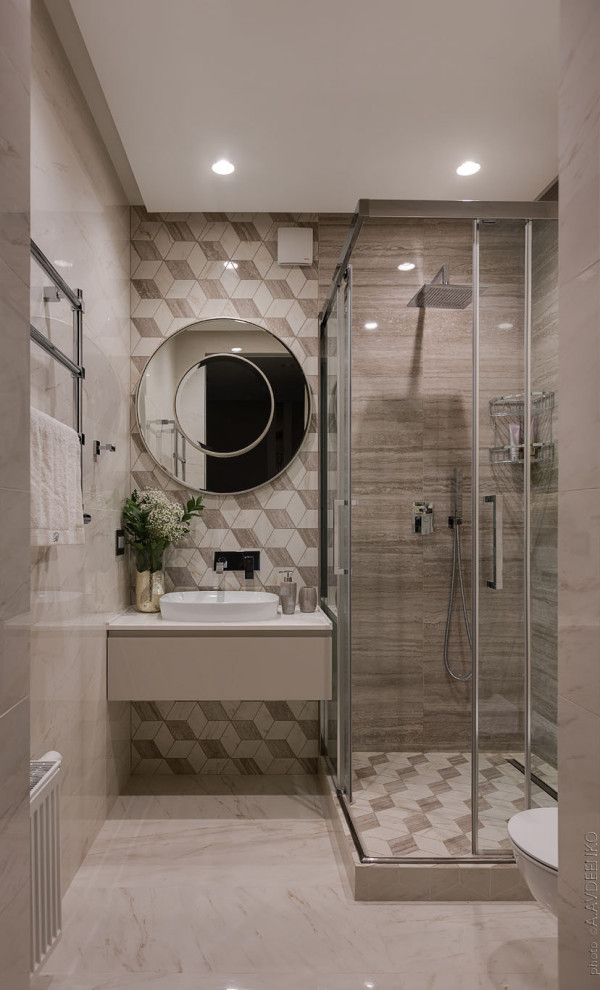 Mid-sized contemporary 3/4 bathroom in Other with flat-panel cabinets, grey cabinets, a corner shower, gray tile, pebble tile, porcelain floors, a vessel sink, beige floor, a hinged shower door and white benchtops.