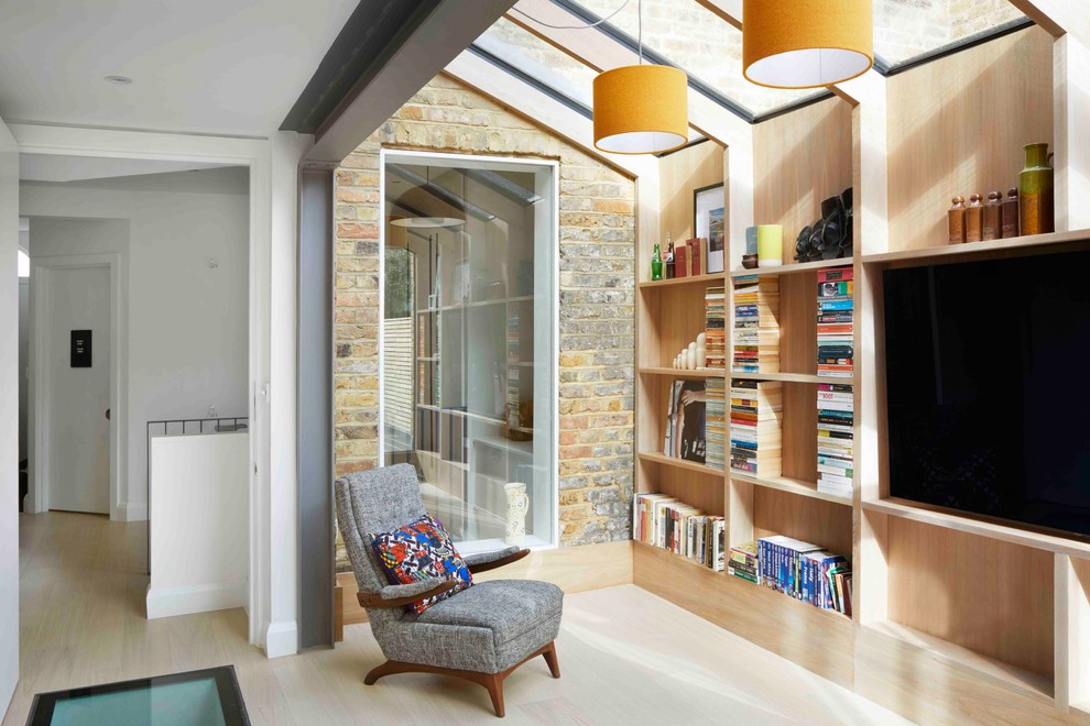 Mid-sized contemporary sunroom in London with light hardwood floors, a skylight and beige floor.