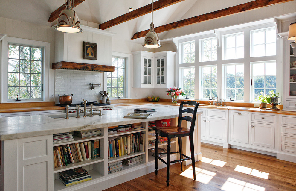 Inspiration for a country kitchen in Philadelphia with recessed-panel cabinets, white cabinets, wood benchtops, white splashback, subway tile splashback, medium hardwood floors and with island.