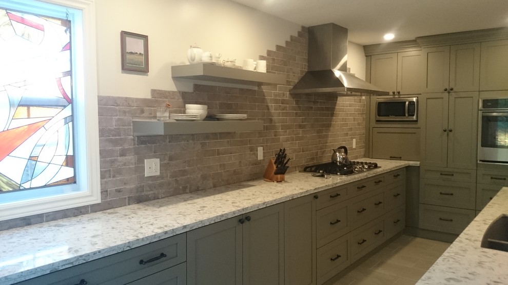 Inspiration for a mid-sized transitional l-shaped porcelain tile eat-in kitchen remodel in Toronto with a double-bowl sink, shaker cabinets, gray cabinets, quartz countertops, multicolored backsplash, porcelain backsplash, stainless steel appliances and an island