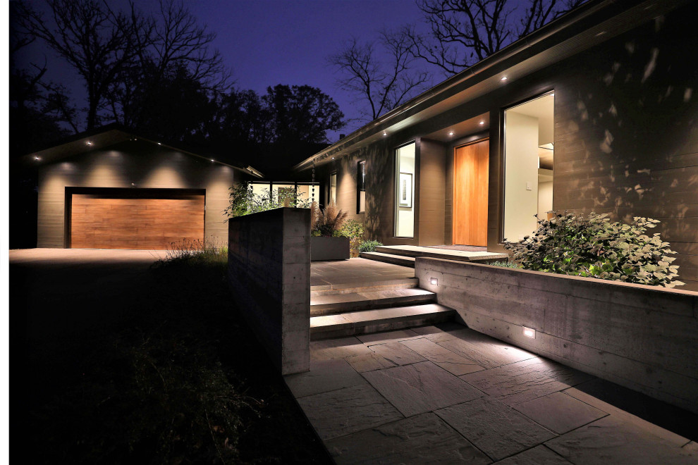 This is an example of a mid-sized mid-century modern partial sun backyard stone walkway in Chicago for summer.