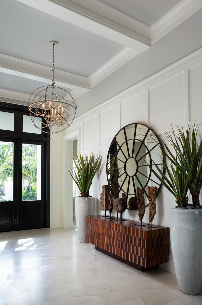 Example of a transitional beige floor foyer design in Miami with gray walls