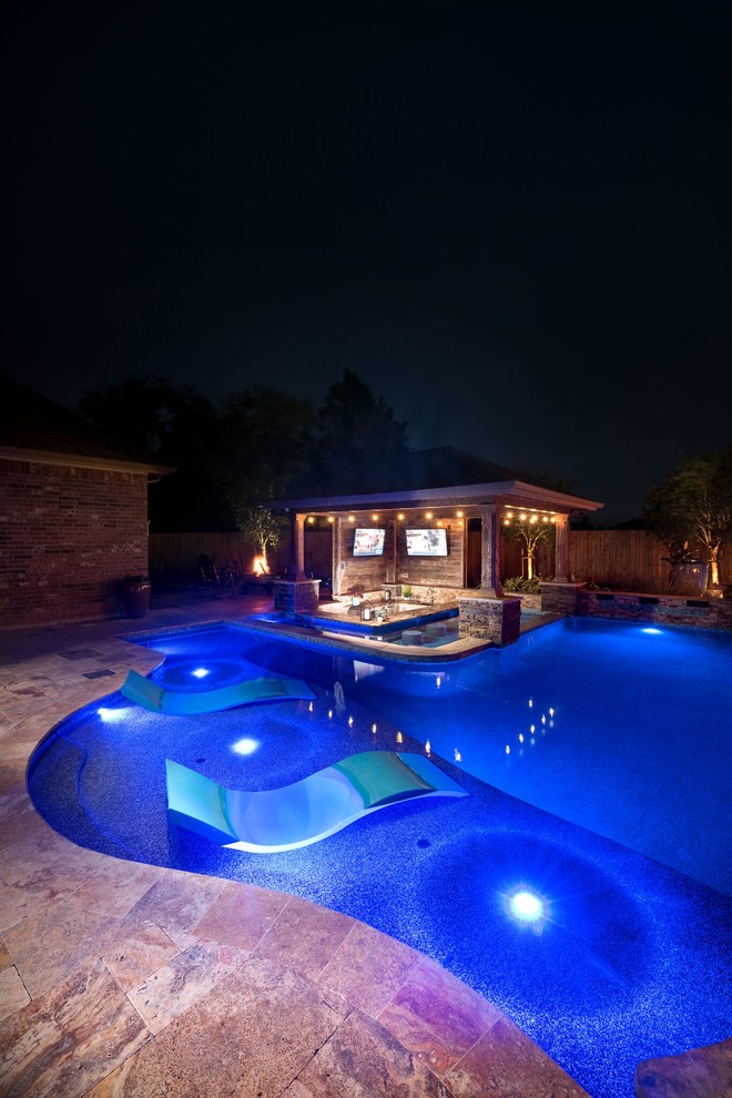 Design ideas for a large modern backyard custom-shaped pool in Houston with tile.