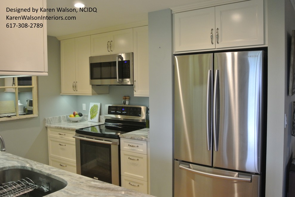 Inspiration for a small transitional galley light wood floor eat-in kitchen remodel in Boston with an undermount sink, recessed-panel cabinets, white cabinets, granite countertops, stone slab backsplash, stainless steel appliances and a peninsula