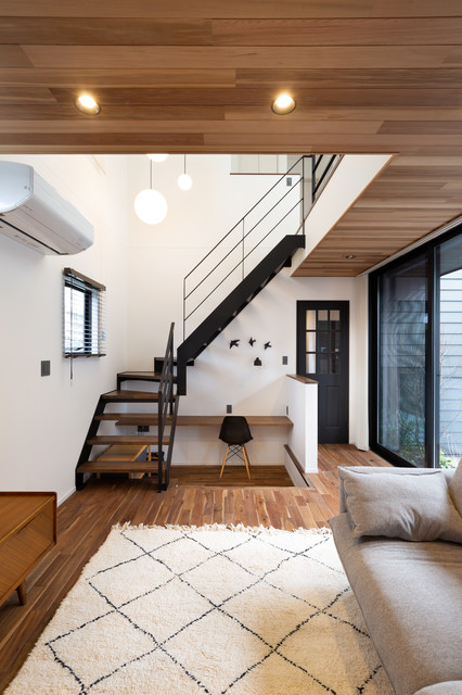 素材の表情を愉しむ家 modern-living-room