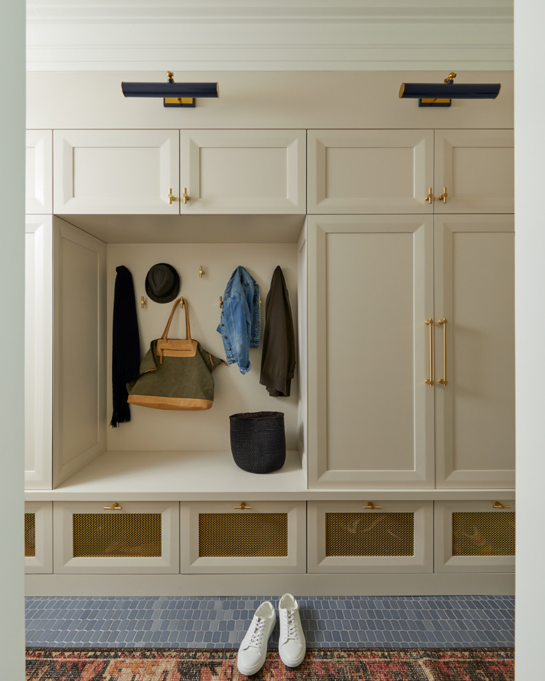 Transitional mudroom in New York with beige walls and blue floor.
