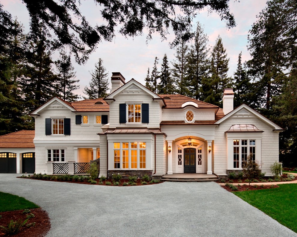 Large traditional three-storey white exterior in San Francisco with a hip roof and wood siding.