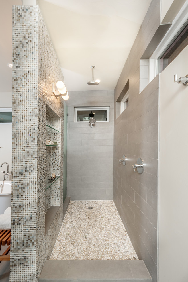 Inspiration for a mid-sized transitional bathroom in Dallas with an undermount sink, an open shower, gray tile, porcelain tile, pebble tile floors, beige walls and an open shower.