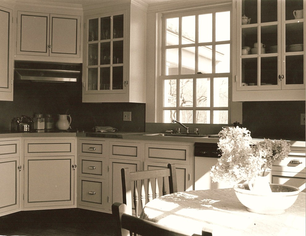 Example of a small classic l-shaped dark wood floor eat-in kitchen design in New York with a single-bowl sink, beaded inset cabinets, white cabinets, laminate countertops, green backsplash, white appliances and no island