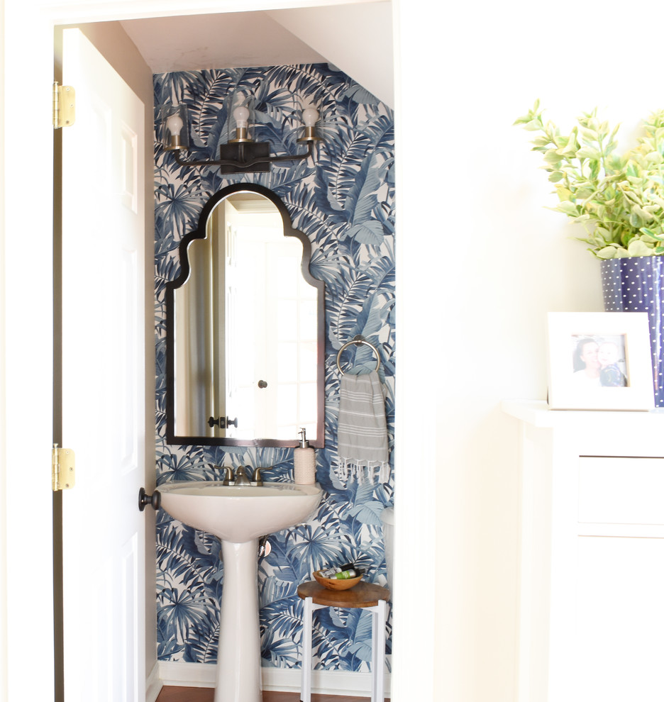 This is an example of a small beach style bathroom in Nashville with blue walls.