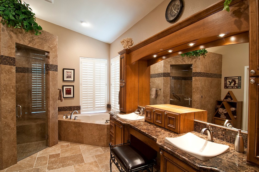 Expansive contemporary master bathroom in Phoenix with a vessel sink, raised-panel cabinets, medium wood cabinets, marble benchtops, an undermount tub, an open shower, beige tile, stone tile, beige walls and travertine floors.