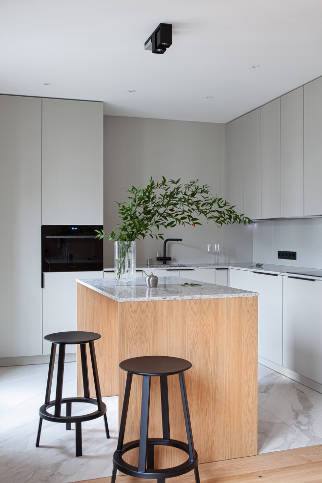 Inspiration for a mid-sized modern l-shaped kitchen in Saint Petersburg with an undermount sink, flat-panel cabinets, grey cabinets, with island, white floor and grey benchtop.