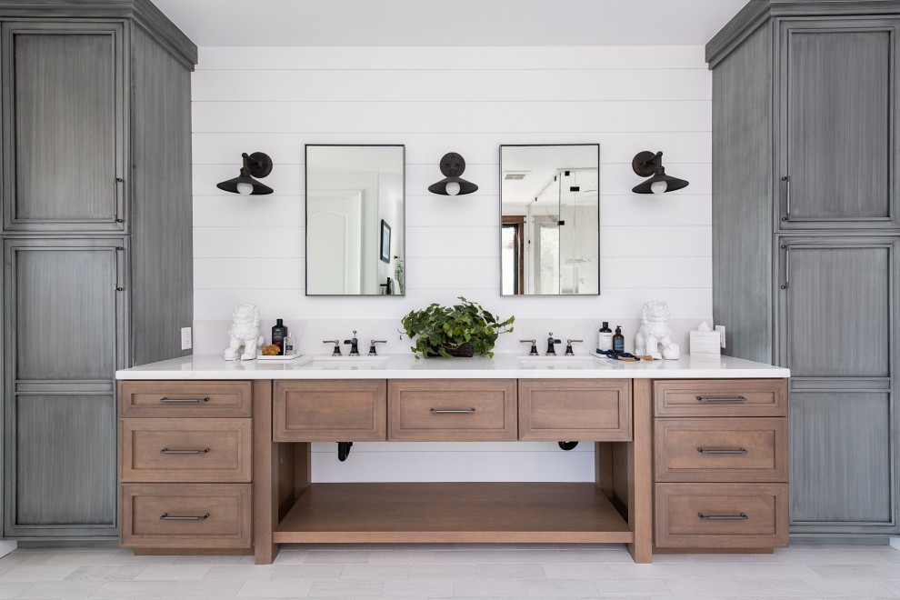 Bathroom - mediterranean master porcelain tile, white floor and double-sink bathroom idea in Orange County with a bidet, white walls, an undermount sink, quartzite countertops, a hinged shower door, white countertops and a built-in vanity