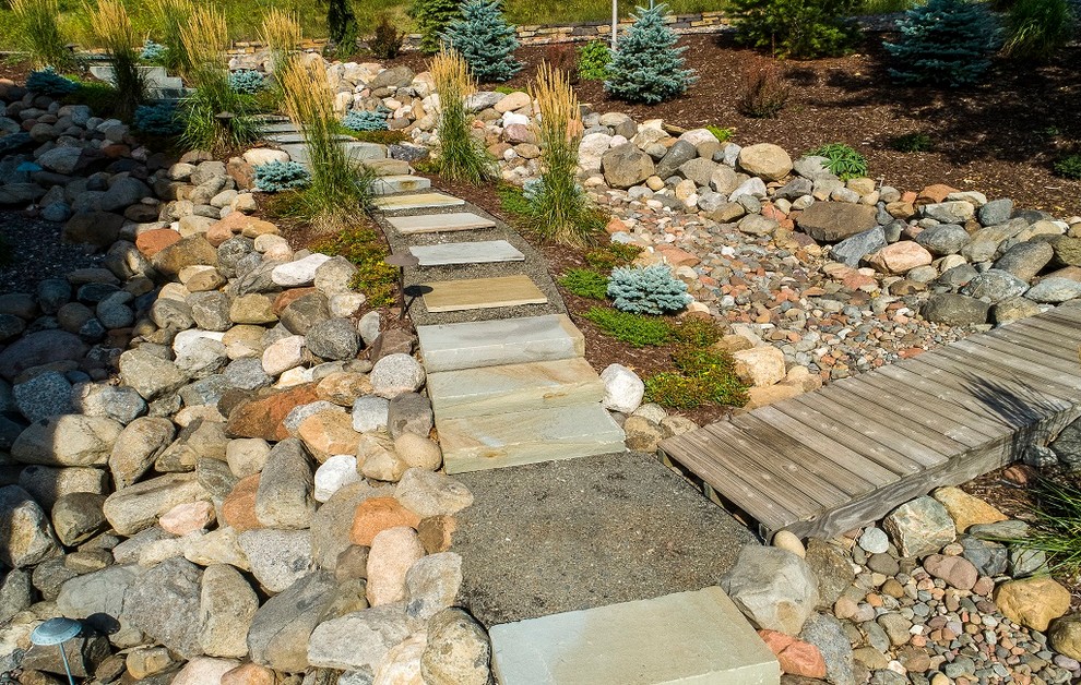Inspiration for a modern hillside stone garden path.