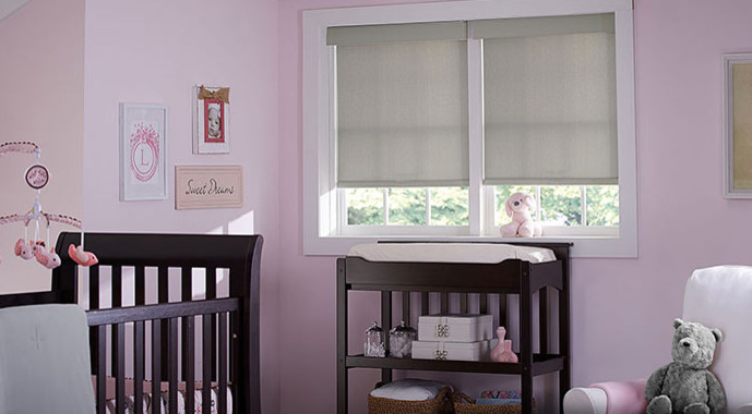 Inspiration for a mid-sized traditional nursery for girls in Los Angeles with pink walls.