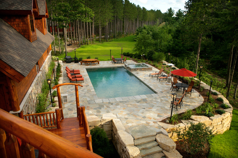 Hot tub - rustic backyard stone and rectangular hot tub idea