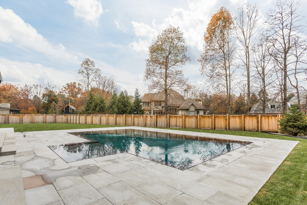 Inspiration for a large backyard concrete paver and custom-shaped pool remodel in Indianapolis