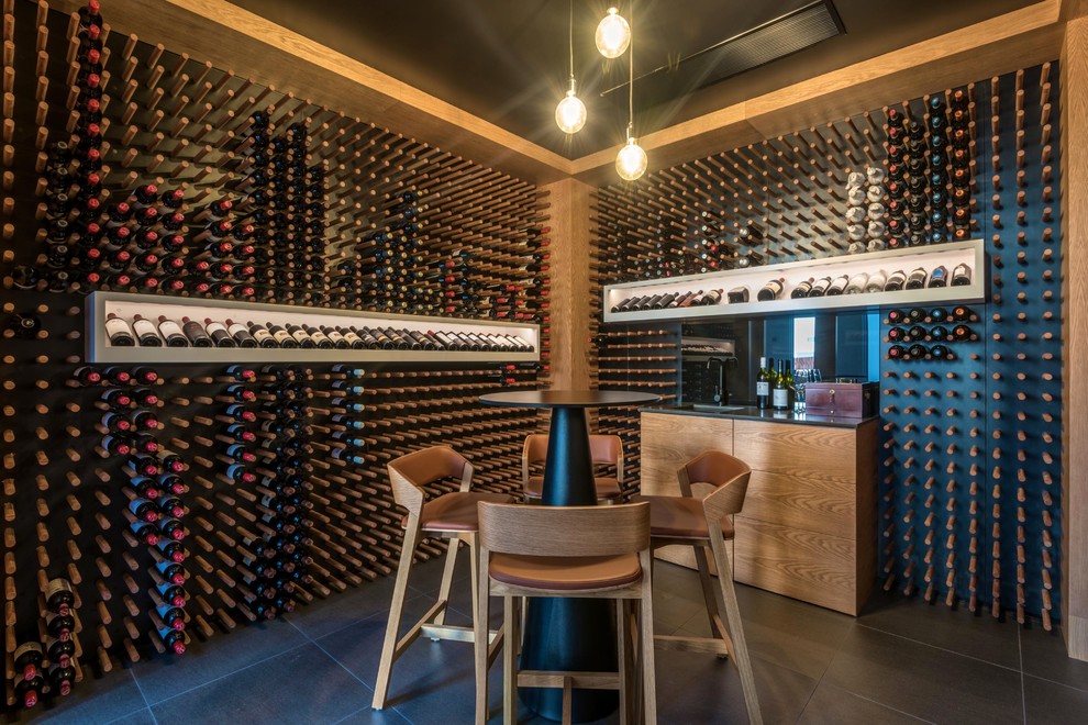 Design ideas for an expansive contemporary wine cellar in Sunshine Coast with ceramic floors, display racks and grey floor.