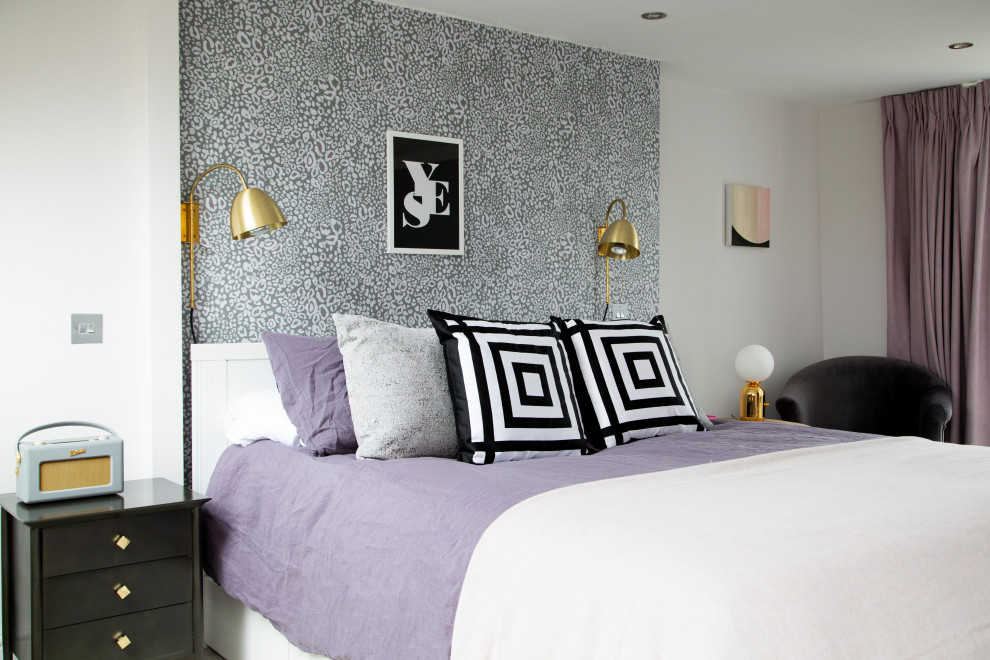 Mid-sized transitional master bedroom in London with purple walls, carpet and grey floor.