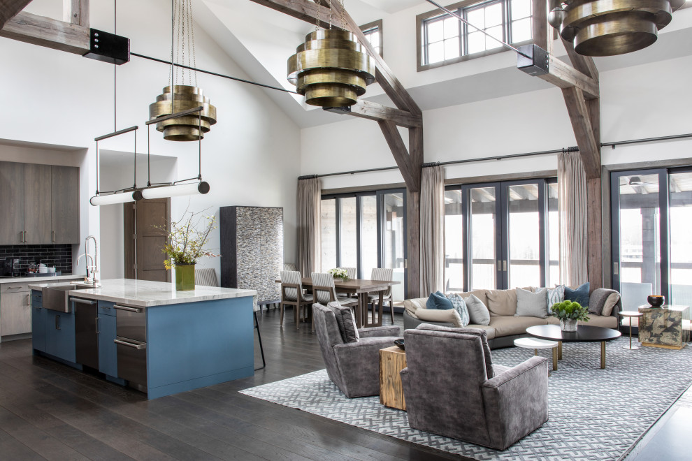 Inspiration for a transitional open concept living room in New York with white walls, dark hardwood floors, brown floor, exposed beam and vaulted.