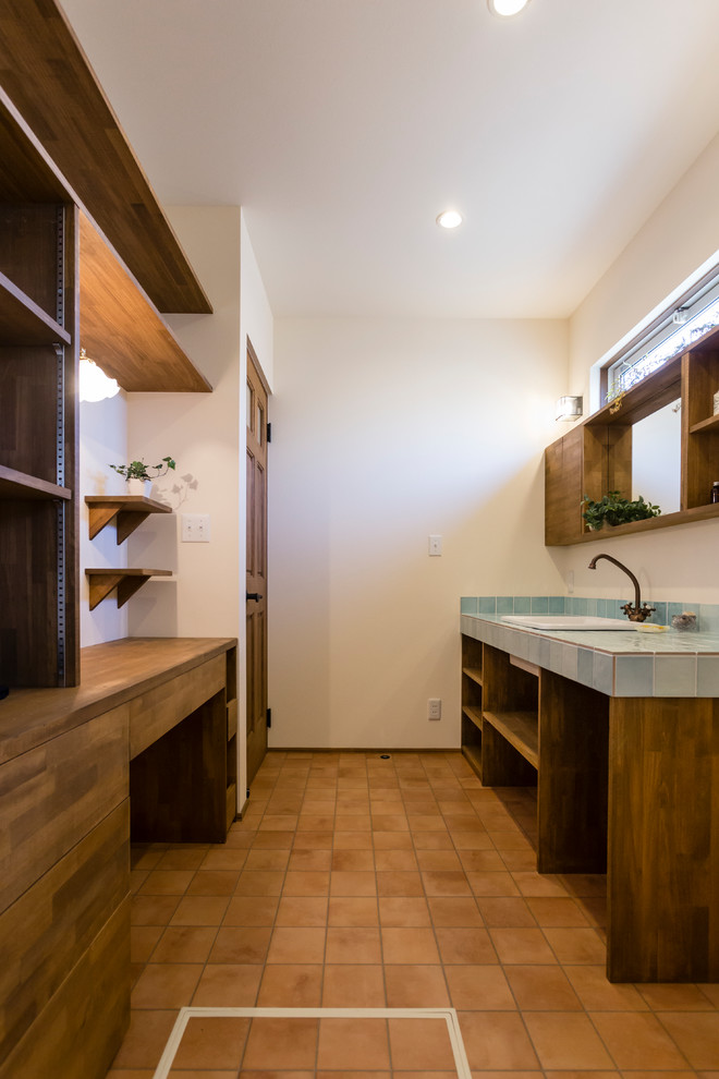 This is an example of a mediterranean powder room in Nagoya.