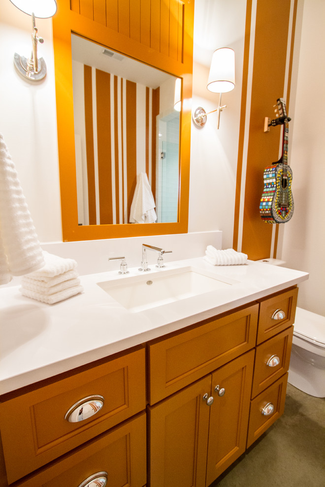 Inspiration for a large traditional bathroom in Nashville with an integrated sink, recessed-panel cabinets, orange cabinets, a one-piece toilet, gray tile, orange walls, ceramic floors and with a sauna.