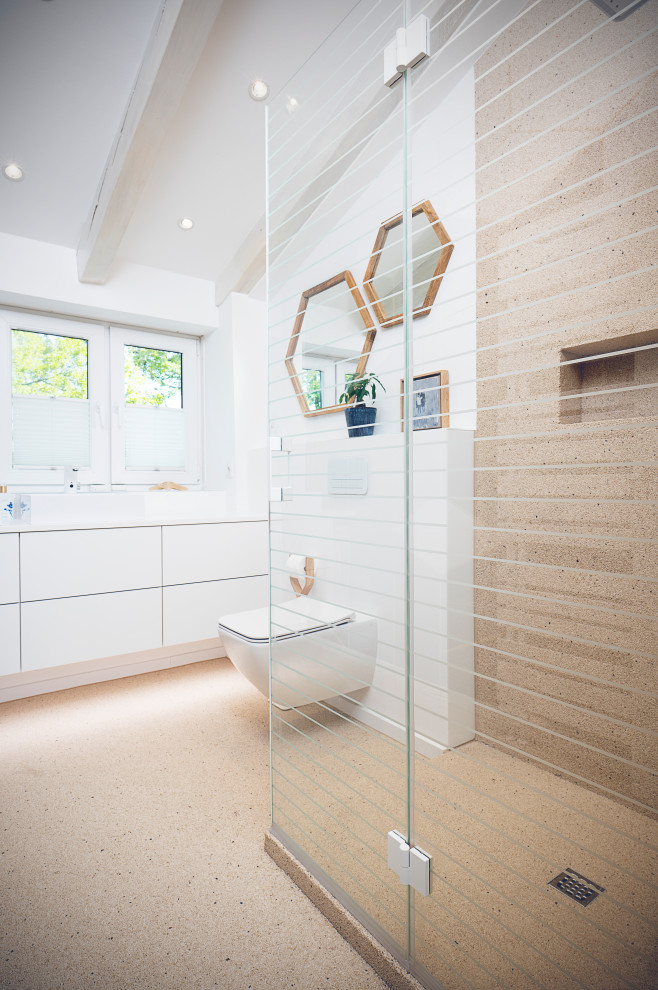This is an example of a medium sized mediterranean shower room bathroom in Dusseldorf with a walk-in shower, beige walls, pebble tile flooring, beige floors, an open shower and a built in vanity unit.