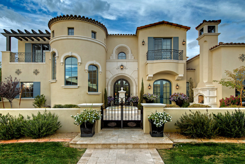 Example of a huge transitional concrete floor front door design in Phoenix with white walls and a glass front door