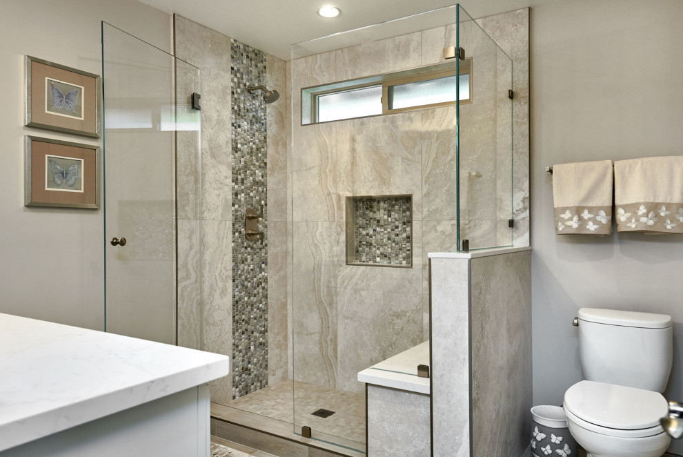 This is an example of a mid-sized transitional 3/4 bathroom in San Francisco with recessed-panel cabinets, white cabinets, an alcove shower, a two-piece toilet, gray tile, porcelain tile, grey walls, porcelain floors, an undermount sink, engineered quartz benchtops, grey floor, a hinged shower door, grey benchtops, a niche, a single vanity and a built-in vanity.