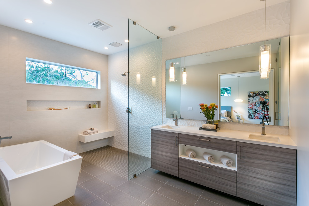 Inspiration for a contemporary master bathroom in Los Angeles with an undermount sink, flat-panel cabinets, grey cabinets, engineered quartz benchtops, a freestanding tub, an open shower, white tile, porcelain tile, white walls, an open shower and a shower seat.