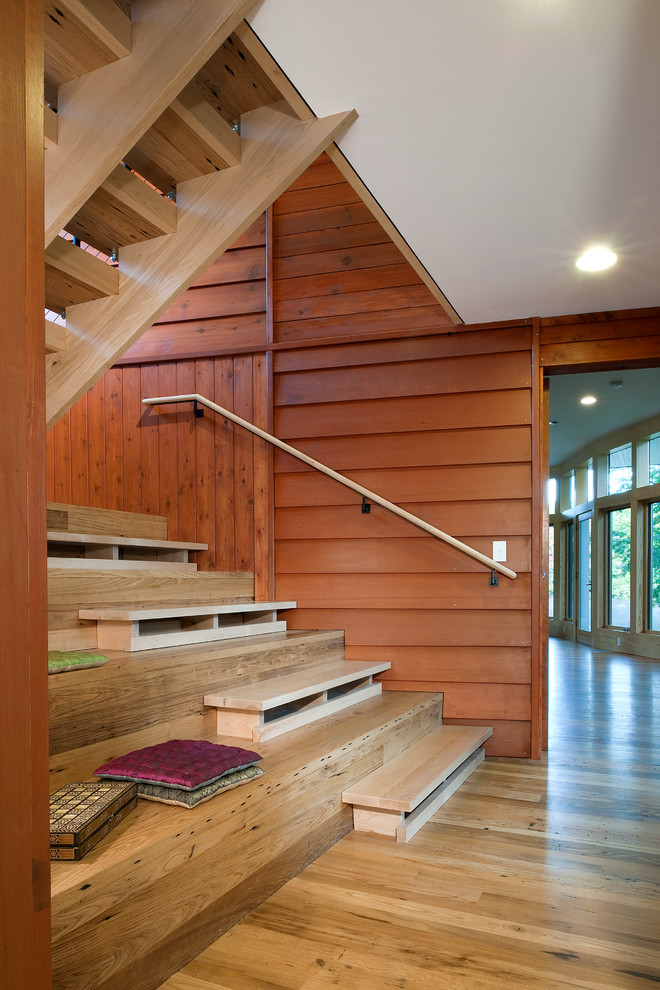 This is an example of a mid-sized contemporary wood u-shaped staircase in DC Metro with wood risers.