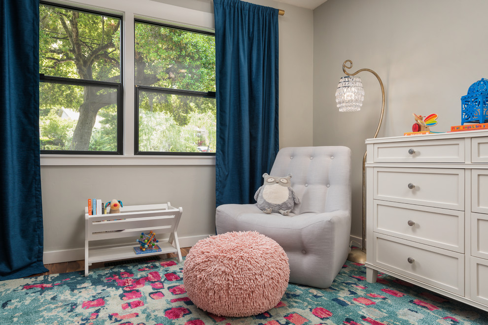 Edgewood - Fairy Tail Bedrooms - Fun, cheerful little girl's room featuring custom house twin bed frame, bright rug, fun twinkly lights, golden lamp, comfy gray reading chair and custom blue drapes. Photo by Exceptional Frames.