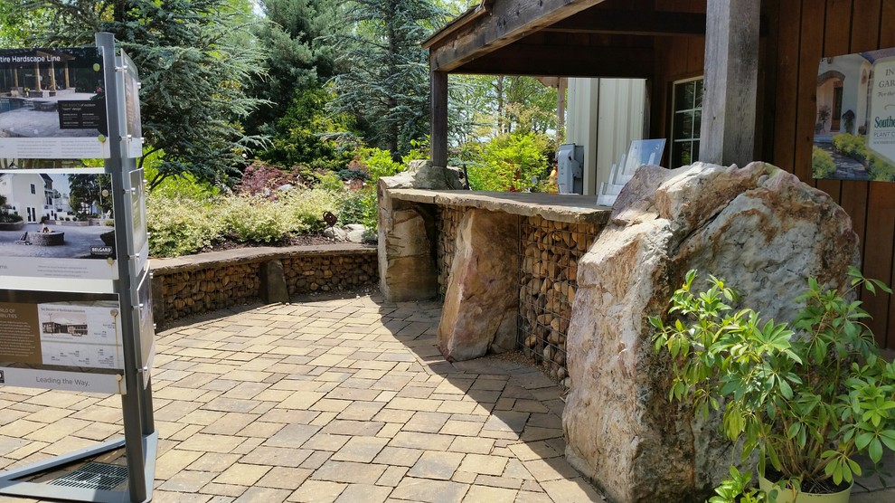 Design ideas for a mid-sized transitional patio in Atlanta with an outdoor kitchen and concrete pavers.