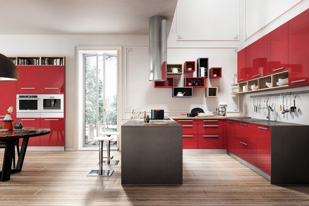 Inspiration for a large modern galley eat-in kitchen in San Diego with a double-bowl sink, flat-panel cabinets, red cabinets, granite benchtops, white splashback, ceramic splashback, panelled appliances, medium hardwood floors and with island.