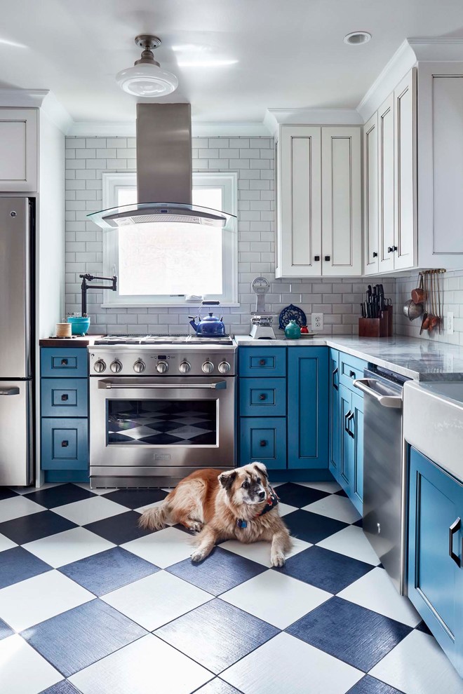 Design ideas for a mid-sized traditional l-shaped separate kitchen in Other with a farmhouse sink, recessed-panel cabinets, blue cabinets, white splashback, subway tile splashback, stainless steel appliances, multi-coloured floor, quartz benchtops, porcelain floors and no island.