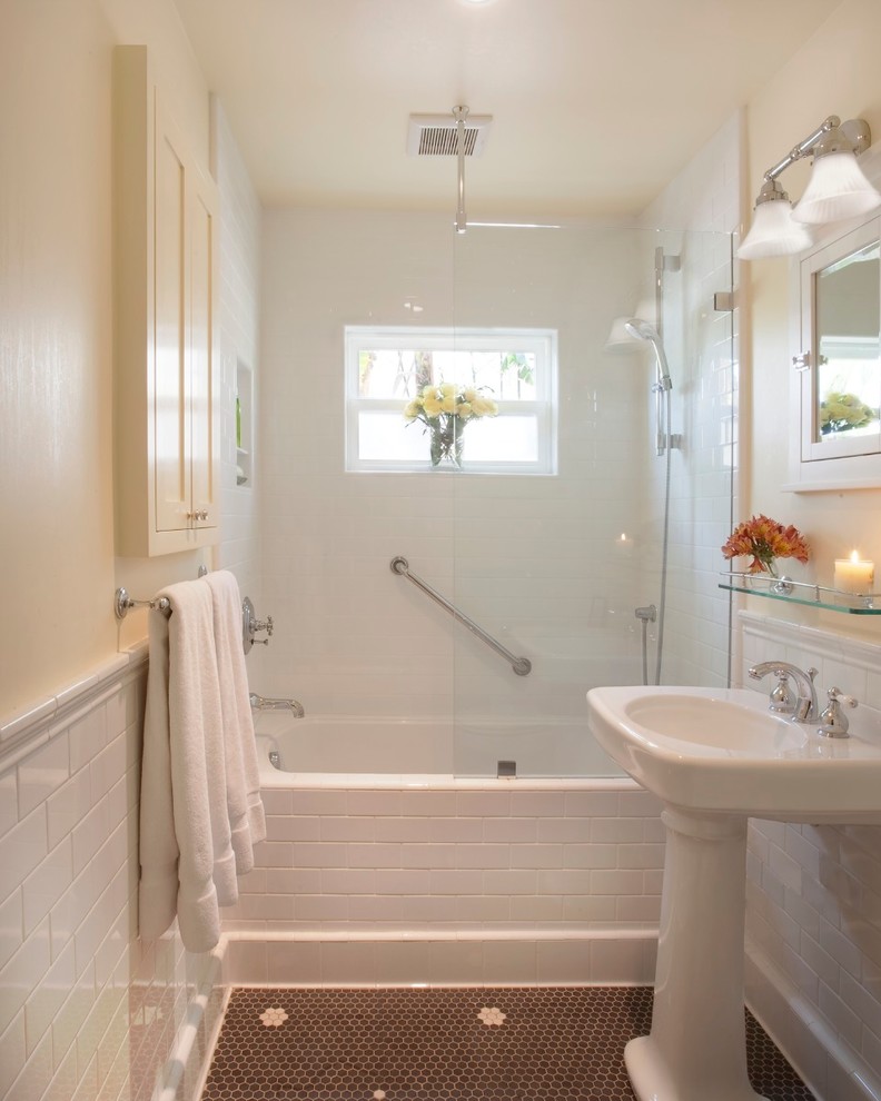 Photo of a small midcentury master bathroom in Santa Barbara with a drop-in tub, a shower/bathtub combo, a one-piece toilet, white tile, subway tile, beige walls, mosaic tile floors and a pedestal sink.