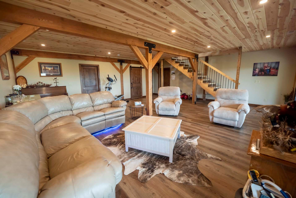 Inspiration for a large rustic walk-out basement with beige walls, medium hardwood flooring, no fireplace, brown floors and a timber clad ceiling.
