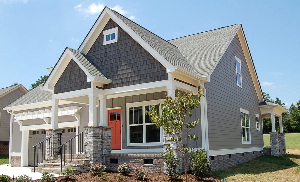 Mid-sized arts and crafts gray one-story concrete fiberboard gable roof photo
