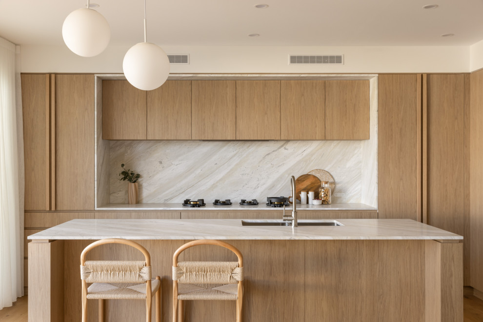 This is an example of a beach style kitchen in Brisbane.