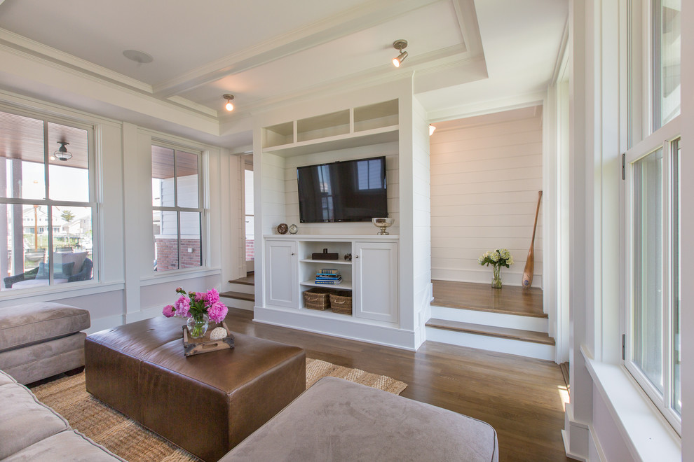 This is an example of a beach style family room in Philadelphia.