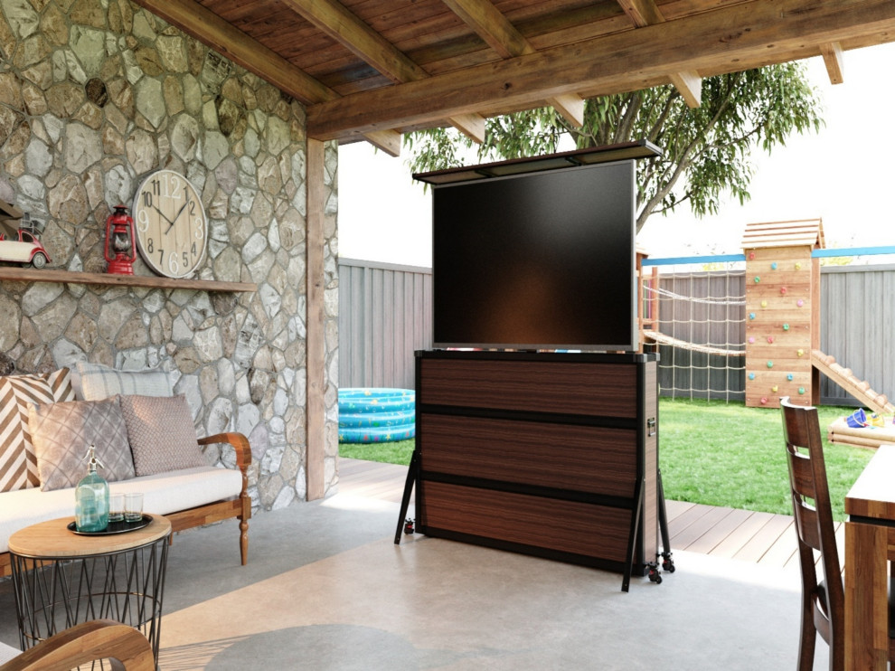 Backyard patio with hidden outdoor TV lift cabinet