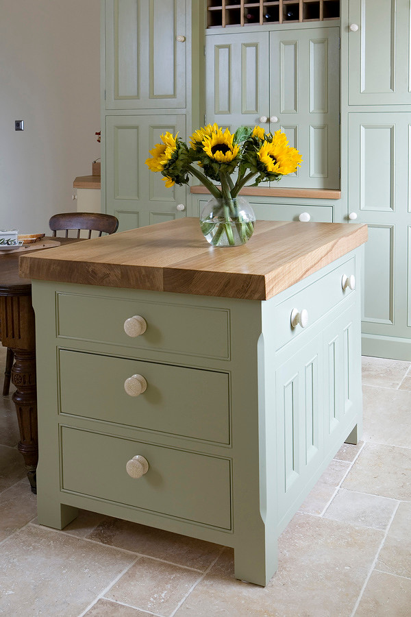 Inspiration for a country kitchen in Other with beaded inset cabinets and wood benchtops.