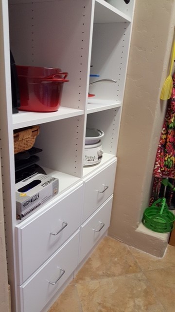 Example of a large transitional galley travertine floor kitchen pantry design in Austin with raised-panel cabinets, white cabinets and no island