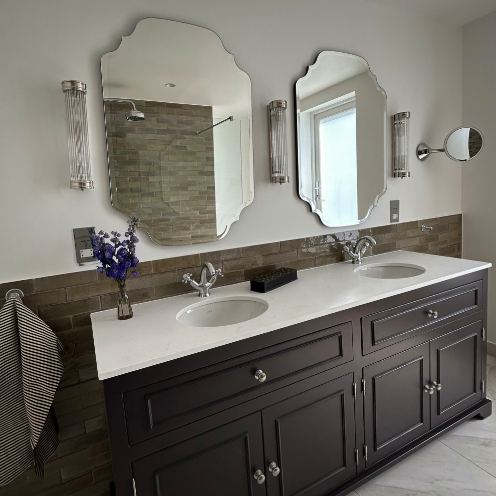Inspiration for a small traditional master bathroom in London with beaded inset cabinets, brown cabinets, an open shower, green tile, ceramic tile, grey walls, ceramic floors, an undermount sink, engineered quartz benchtops, grey floor, an open shower, white benchtops, a double vanity and a freestanding vanity.