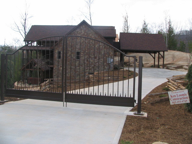 Example of a mountain style three-story exterior home design