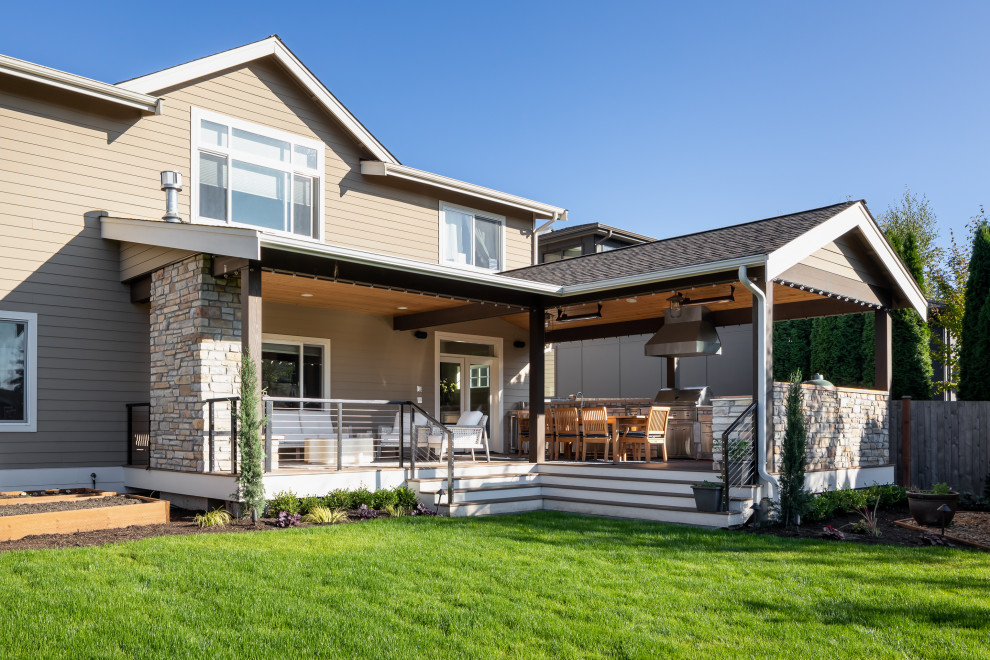 Inspiration for a large contemporary beige two-story stone and clapboard exterior home remodel in Seattle with a shingle roof and a gray roof